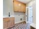 Spacious mudroom with coat rack and wooden cabinets at 3432 Greene Rd, Monroe, NC 28110