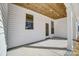 Covered back porch with wood ceiling and white siding at 3436 Greene Rd, Monroe, NC 28110