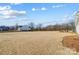 Large backyard with new construction homes in background at 3436 Greene Rd, Monroe, NC 28110