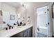 Bathroom with double vanity and a view into a shower and tub at 3436 Greene Rd, Monroe, NC 28110