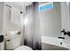 Clean bathroom with a shower/tub combo and window at 3436 Greene Rd, Monroe, NC 28110