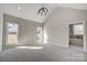 Spacious bedroom with vaulted ceiling, carpet, and natural light at 3436 Greene Rd, Monroe, NC 28110