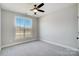 Well-lit bedroom featuring a large window and ceiling fan at 3436 Greene Rd, Monroe, NC 28110