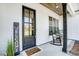 Inviting front porch features rocking chairs and a stylish welcome sign at 3436 Greene Rd, Monroe, NC 28110