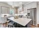 Modern kitchen with white cabinets, stainless steel appliances, and marble countertops at 3436 Greene Rd, Monroe, NC 28110