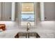 Modern kitchen sink with marble countertop and window view at 3436 Greene Rd, Monroe, NC 28110