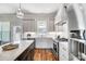 Modern kitchen features stainless steel appliances and marble countertops at 3436 Greene Rd, Monroe, NC 28110