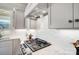 Kitchen detail showing gas cooktop and white subway tile backsplash at 3436 Greene Rd, Monroe, NC 28110
