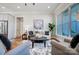 Bright living room with hardwood floors, plush seating, and a modern coffee table at 3436 Greene Rd, Monroe, NC 28110