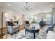 Open living space with hardwood floors, comfortable seating, and views into kitchen at 3436 Greene Rd, Monroe, NC 28110