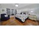 Spacious bedroom with hardwood floors, a dresser, and a comfortable bed at 3935 Yosemite Way, Fort Mill, SC 29707