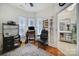 Home office with built-in shelving and hardwood floors at 3935 Yosemite Way, Fort Mill, SC 29707