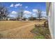 Landscaped side yard with mature trees and open space at 3935 Yosemite Way, Fort Mill, SC 29707