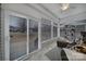 Sunroom features tiled floor, seating area, and sliding glass doors at 3935 Yosemite Way, Fort Mill, SC 29707