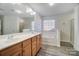 Bathroom with double vanity and bathtub at 4005 Linville Falls Ln, Monroe, NC 28110