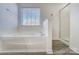 Bathroom with soaking tub and shower at 4005 Linville Falls Ln, Monroe, NC 28110