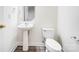 Simple bathroom with pedestal sink and toilet at 4005 Linville Falls Ln, Monroe, NC 28110
