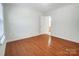 Bedroom with wood flooring and access to bathroom at 4005 Linville Falls Ln, Monroe, NC 28110