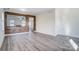 Spacious dining area with wood accent wall and grey flooring at 4005 Linville Falls Ln, Monroe, NC 28110