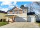 Two-story house with a two-car garage and a landscaped front yard at 4005 Linville Falls Ln, Monroe, NC 28110