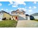 Two-story house with a two-car garage and a well-manicured lawn at 4005 Linville Falls Ln, Monroe, NC 28110