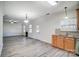 Open floor plan with kitchen, living room, and fireplace at 4005 Linville Falls Ln, Monroe, NC 28110