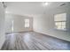 Living room with grey flooring and neutral color walls at 4005 Linville Falls Ln, Monroe, NC 28110
