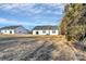View of house and backyard, additional house visible at 4109 Pebblebrook Sw Cir, Concord, NC 28027