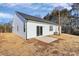 White house exterior showcasing a patio and AC unit at 4109 Pebblebrook Sw Cir, Concord, NC 28027