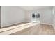 Bright and airy living room with hardwood floors and sliding glass doors at 4109 Pebblebrook Sw Cir, Concord, NC 28027