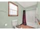 Bathroom features a tub shower, toilet and linen closet at 4641 Hickory Grove Rd, Sharon, SC 29742