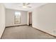 Simple bedroom with carpet flooring, ceiling fan, and a window with blinds at 4641 Hickory Grove Rd, Sharon, SC 29742