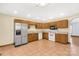 Spacious kitchen featuring ample wood cabinets, stainless steel appliances, and tile flooring at 4641 Hickory Grove Rd, Sharon, SC 29742