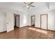 Hardwood floor main bedroom with doors to bathroom and hallway at 4641 Hickory Grove Rd, Sharon, SC 29742
