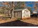 Tan yard shed with double doors at 4641 Hickory Grove Rd, Sharon, SC 29742