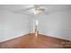 Well-lit bedroom with wood floors and ceiling fan at 5413 Mallard S Dr, Charlotte, NC 28227