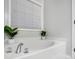 Relaxing bathroom with soaking tub and window at 5517 Cyrus Lee Ln, Monroe, NC 28110