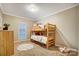 Bedroom with a bunk bed and a small rug at 5517 Cyrus Lee Ln, Monroe, NC 28110