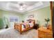 Spacious bedroom with wood bed frame and ceiling fan at 5517 Cyrus Lee Ln, Monroe, NC 28110
