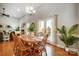 Bright dining room features a wood table with chairs and access to a deck at 5517 Cyrus Lee Ln, Monroe, NC 28110
