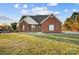 Brick ranch house with a spacious lawn at 5517 Cyrus Lee Ln, Monroe, NC 28110