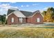Brick ranch home with a large front yard at 5517 Cyrus Lee Ln, Monroe, NC 28110