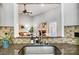 Kitchen features a granite countertop sink with a view into the living room at 5517 Cyrus Lee Ln, Monroe, NC 28110
