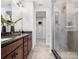 This bathroom boasts a glass walk-in shower, modern fixtures, and plenty of vanity space at 5628 Kingspan Dr, Charlotte, NC 28217