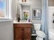 This bathroom features a toilet, vanity with sink, and shower with curtain at 5628 Kingspan Dr, Charlotte, NC 28217