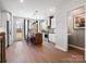 This open-concept kitchen boasts stainless steel appliances, a breakfast bar, and modern fixtures at 5628 Kingspan Dr, Charlotte, NC 28217