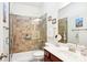 Bathroom with tiled shower, glass enclosure, and vanity at 8814 Beaver Creek Dr, Charlotte, NC 28269