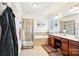 Spa-like bathroom featuring double sinks, a shower, and a soaking tub at 8814 Beaver Creek Dr, Charlotte, NC 28269