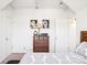 Simple bedroom with a dresser and a double bed at 8814 Beaver Creek Dr, Charlotte, NC 28269