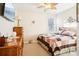 Bedroom with wood dresser, ceiling fan, and a patchwork quilt at 8814 Beaver Creek Dr, Charlotte, NC 28269